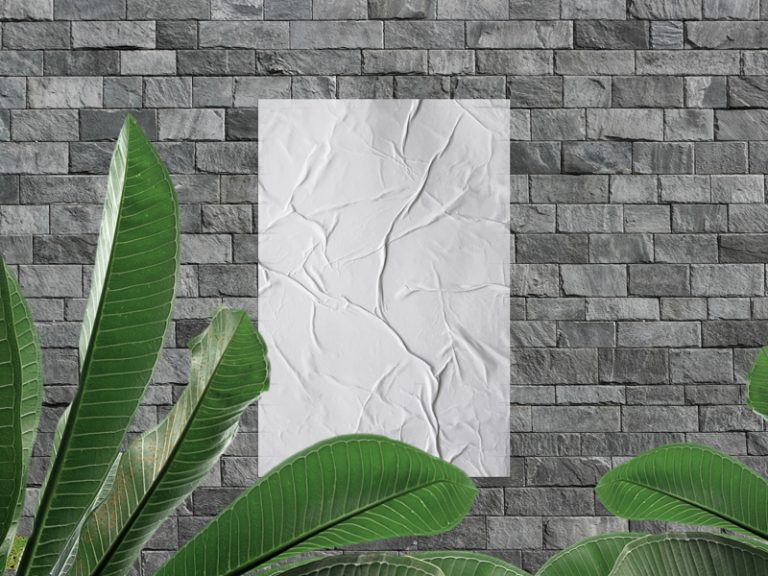 Download Glued Poster on Stone Wall Mockup With Leaves - Poster Mockup